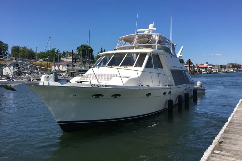 Slide: The Image of 2008 Meridian 490 Pilothouse yacht docked in a marina under clear blue skies. - 59
