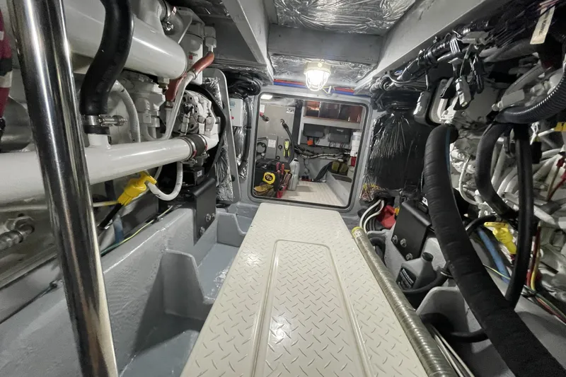 Slide: The Image of Engine room of a 2008 Meridian 490 Pilothouse yacht, showcasing mechanical components. - 72