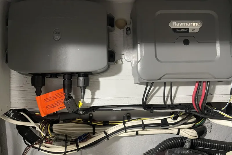Slide: The Image of Electrical components in a 2008 Meridian 490 Pilothouse, featuring Raymarine SmartPilot X30 system. - 73