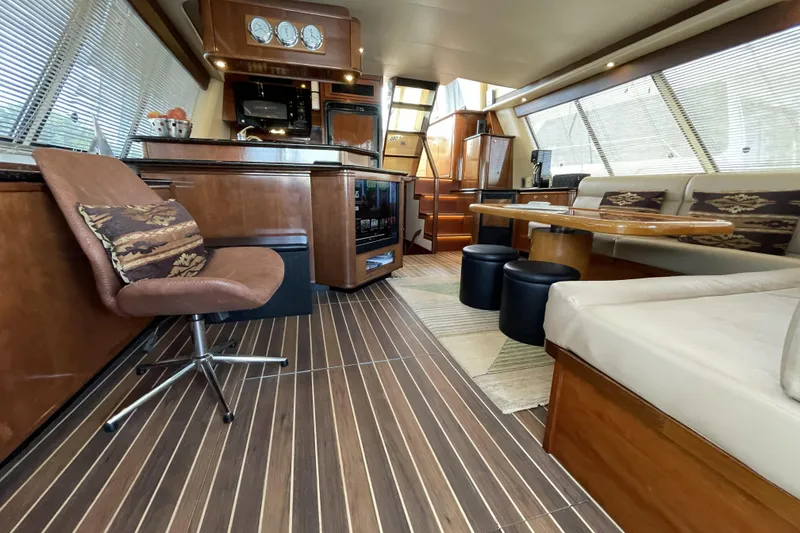 Slide: The Image of Luxurious interior of a 2008 Meridian 490 Pilothouse yacht with elegant wood finishes. - 74