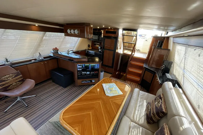 Slide: The Image of Luxurious interior of a 2008 Meridian 490 Pilothouse yacht with elegant wood finishes. - 8