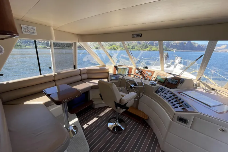 Slide: The Image of Pilothouse interior of 2008 Meridian 490 yacht with panoramic windows and modern navigation equipment. - 9