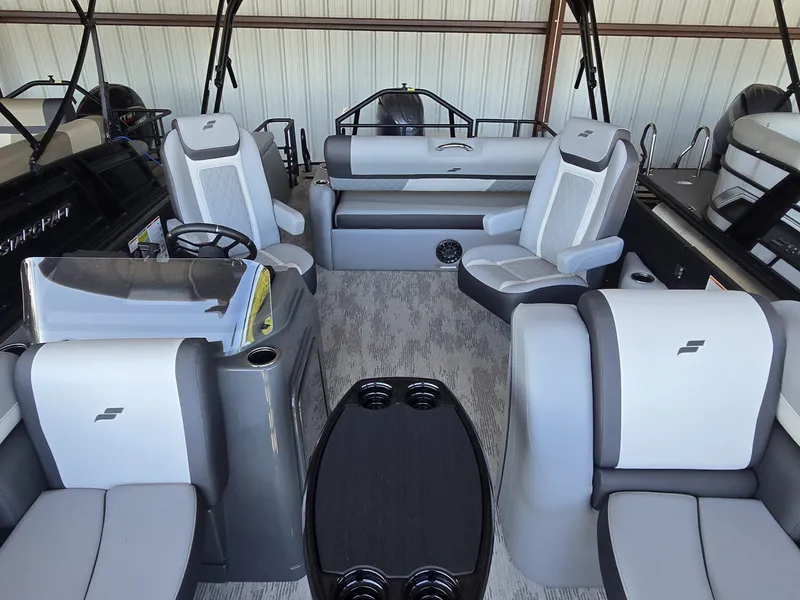 Slide: The Image of The image shows the interior of a 2027 Starcraft EXS 1 Q DH boat with gray seating. - 20