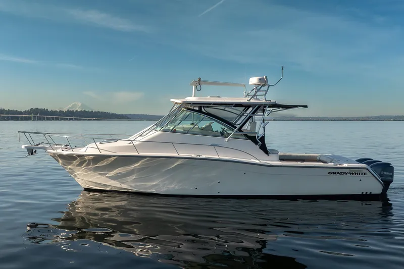 The Image of 2006 Grady-White Express 360 boat on calm water under clear blue sky. - 0