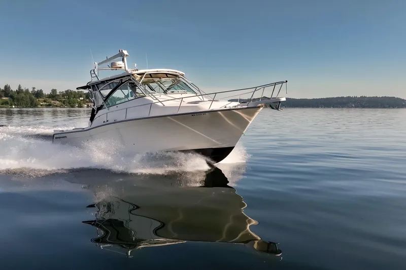 Slide: The Image of 2006 Grady-White Express 360 cruising on calm waters under clear skies. - 13