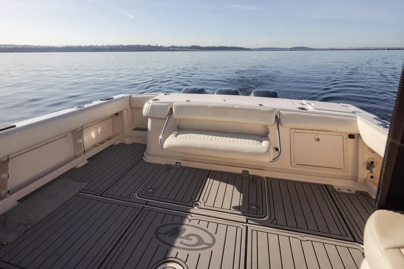 Slide: The Image of 2006 Grady-White Express 360 boat deck with seating, overlooking calm waters. - 15