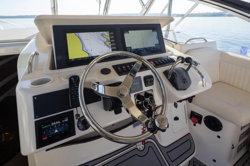 Slide: The Image of Helm of 2006 Grady-White Express 360 with dual displays and steering wheel. - 17