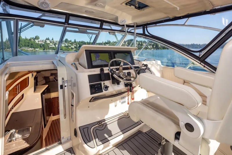 Slide: The Image of 2006 Grady-White Express 360 boat interior with helm, navigation system, and cabin view. - 21