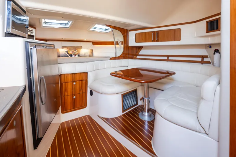 Slide: The Image of Luxurious interior of 2006 Grady-White Express 360 boat with wood accents and cozy seating. - 22