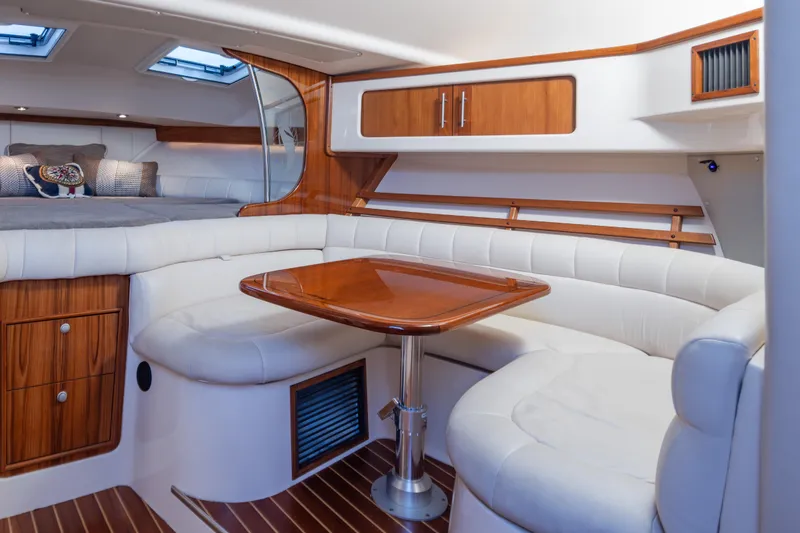 Slide: The Image of Luxurious 2006 Grady-White Express 360 cabin interior with elegant wood finishes and plush seating. - 23