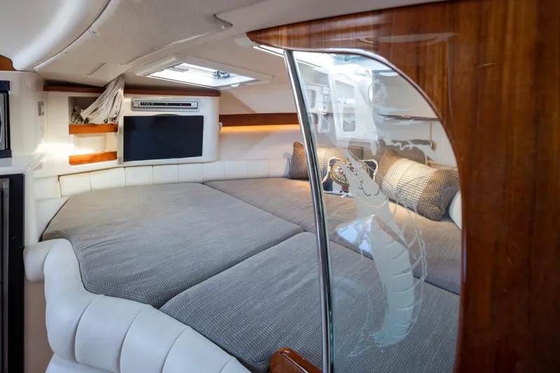 Slide: The Image of Luxurious cabin interior of 2006 Grady-White Express 360 boat with cozy bedding. - 25
