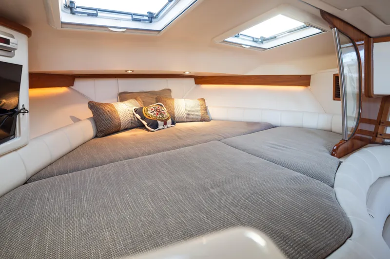 Slide: The Image of Luxurious cabin interior of 2006 Grady-White Express 360 boat with plush bedding. - 26
