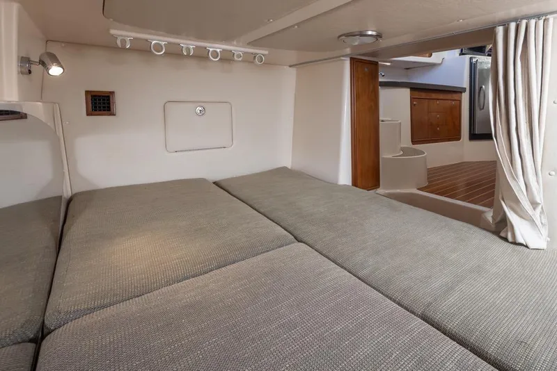 Slide: The Image of Interior cabin of 2006 Grady-White Express 360 boat, featuring cozy sleeping area. - 30