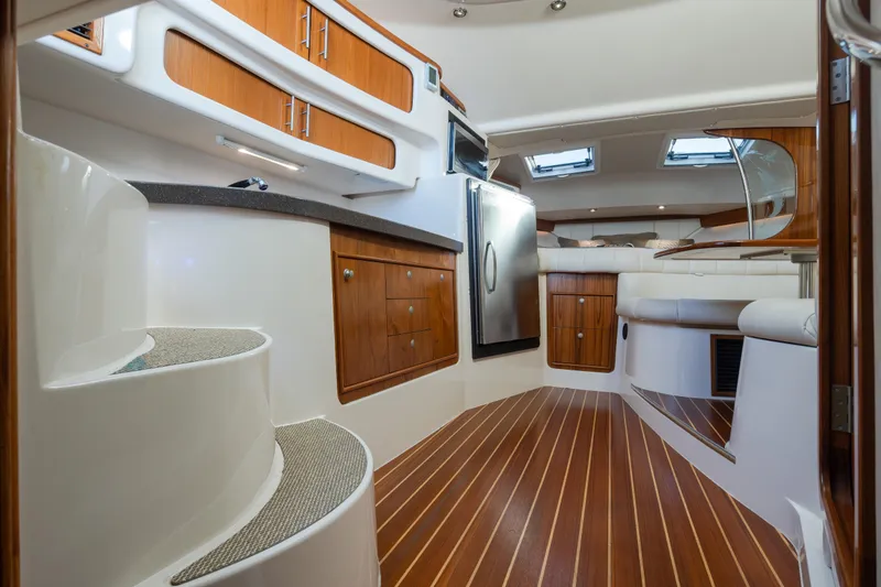 Slide: The Image of Interior of 2006 Grady-White Express 360 boat with wood flooring and modern amenities. - 32