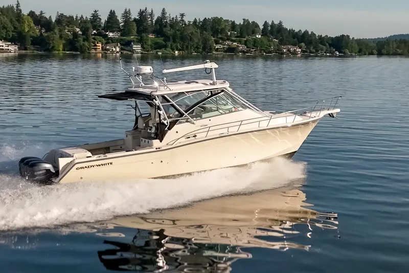 Slide: The Image of 2006 Grady-White Express 360 boat cruising on a serene lake. - 40