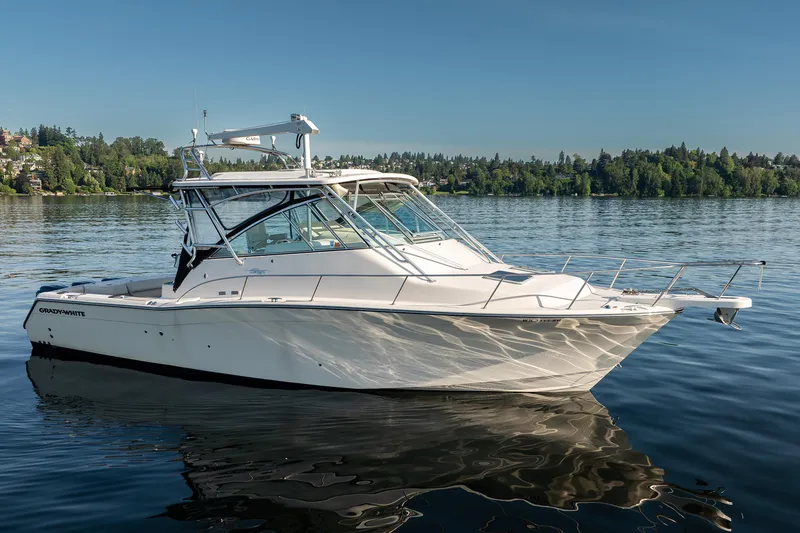 Slide: The Image of 2006 Grady-White Express 360 boat on calm lake with scenic forested background. - 6