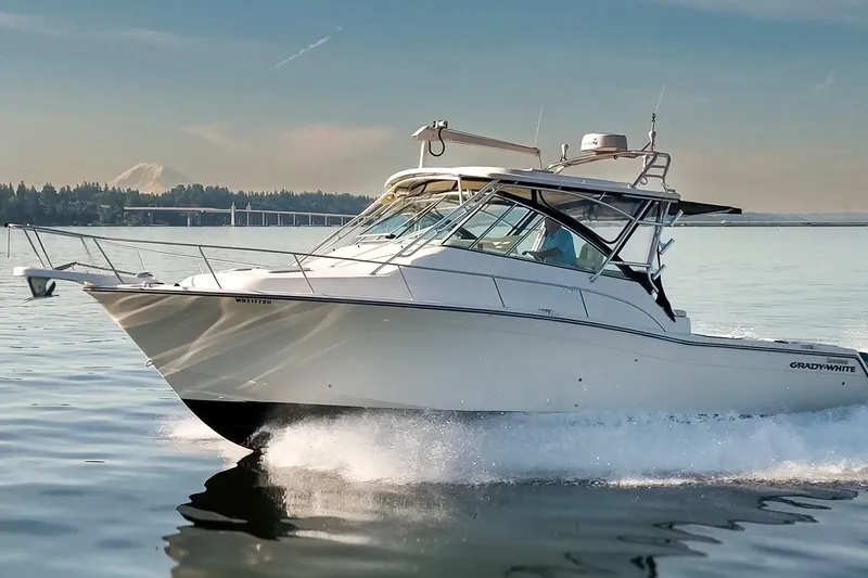 Slide: The Image of 2006 Grady-White Express 360 cruising on calm waters with scenic background. - 8