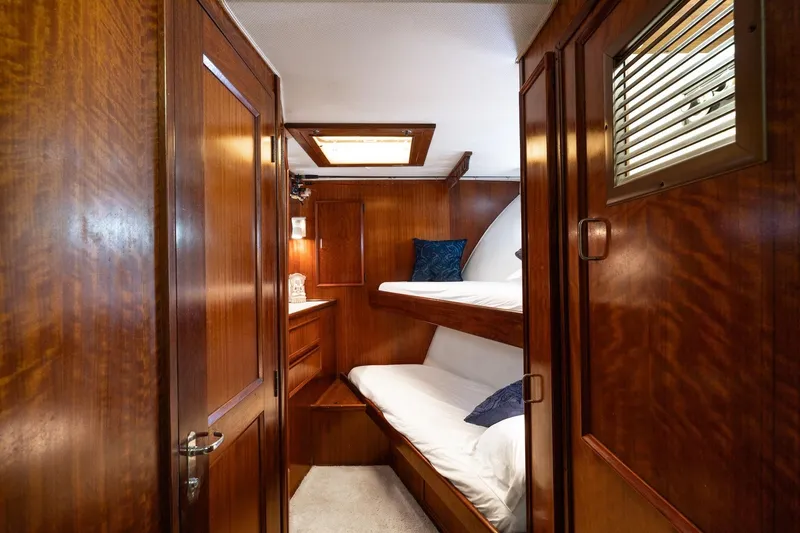 Slide: The Image of 1978 Hatteras 53 Yacht Fisherman cabin with wooden interior and bunk beds. - 59