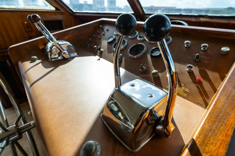 Slide: The Image of 1978 Hatteras 53 Yacht Fisherman helm with vintage controls and gauges. - 75