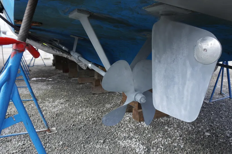 Slide: The Image of 1978 Hatteras 53 Yacht Fisherman propeller and rudder detail on dry dock. - 89