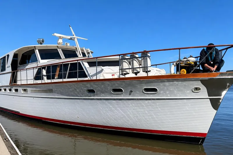 The Image of 1965 Pacemaker 53 Motor Yacht docked, featuring classic design and sleek white hull. - 0