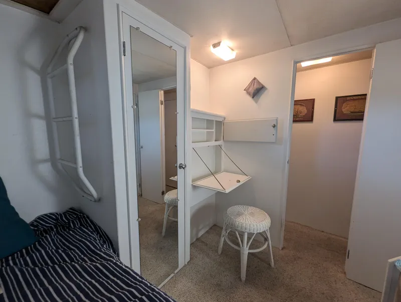 Slide: The Image of Interior of 1965 Pacemaker 53 Motor Yacht with mirror, desk, and stool. - 16