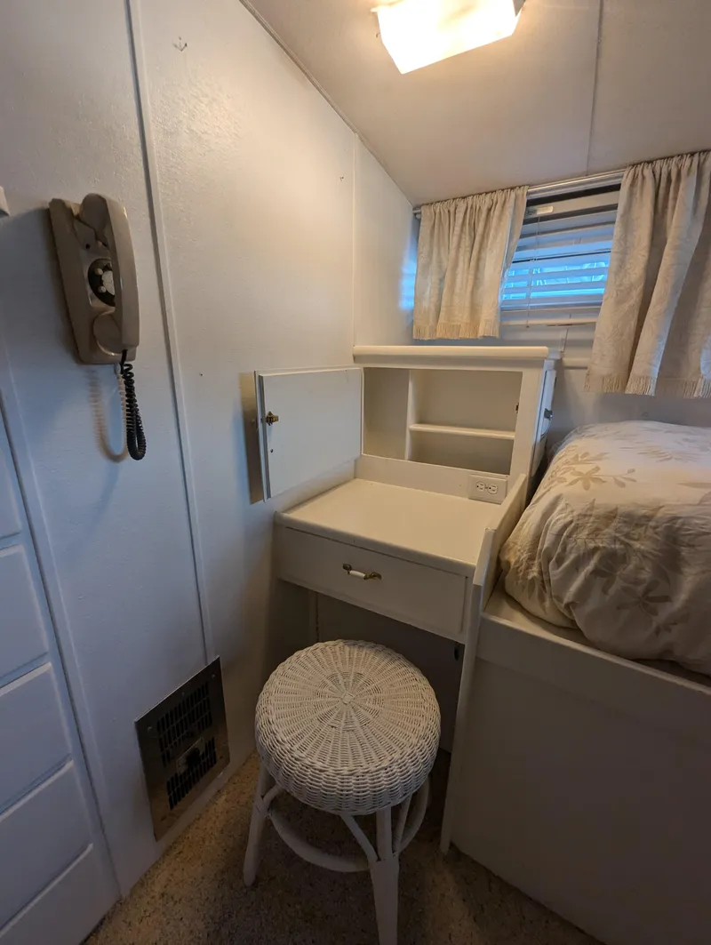 Slide: The Image of Cozy cabin interior of 1965 Pacemaker 53 Motor Yacht with vintage decor and furnishings. - 17