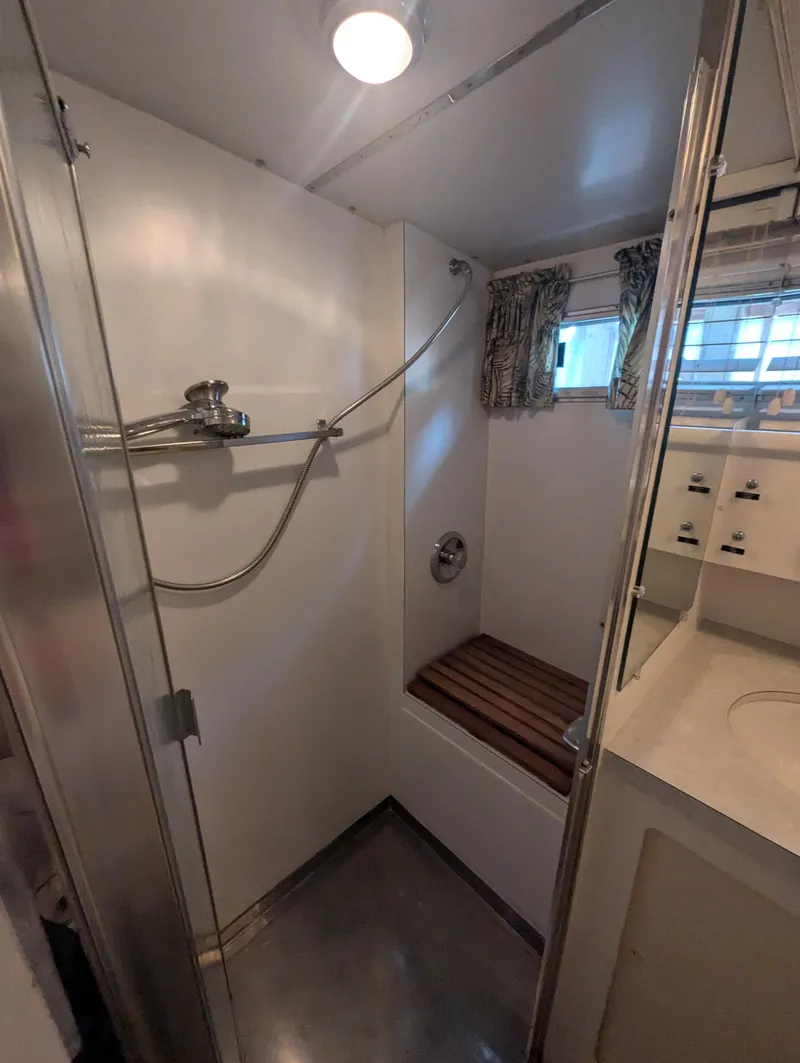 Slide: The Image of Bathroom interior of a 1965 Pacemaker 53 Motor Yacht, featuring a shower and sink. - 18