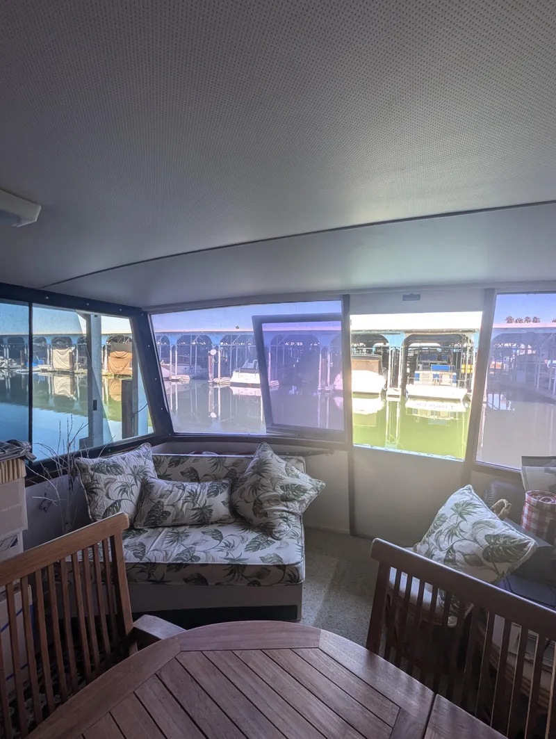 Slide: The Image of Interior of 1965 Pacemaker 53 Motor Yacht with marina view through large windows. - 24