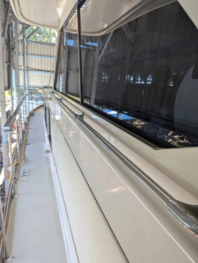 Slide: The Image of 1965 Pacemaker 53 Motor Yacht side view in a covered dock. - 26