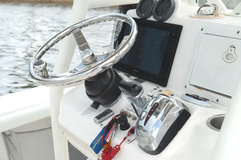 Slide: The Image of Steering console of 2007 Everglades 243 Center Console boat with modern controls. - 18