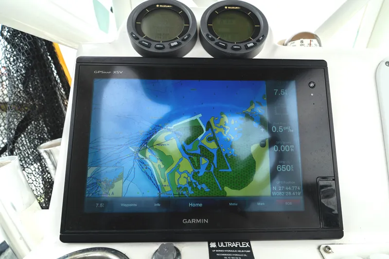 Slide: The Image of Garmin GPS display on 2007 Everglades 243 Center Console boat, showing navigation map. - 23