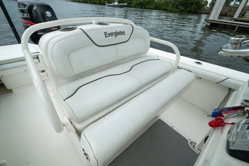 Slide: The Image of 2007 Everglades 243 Center Console boat with white seating and Suzuki outboard motor. - 35