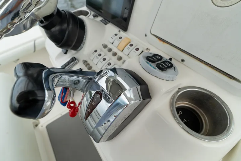 Slide: The Image of Close-up of 2007 Everglades 243 Center Console boat controls and dashboard. - 36