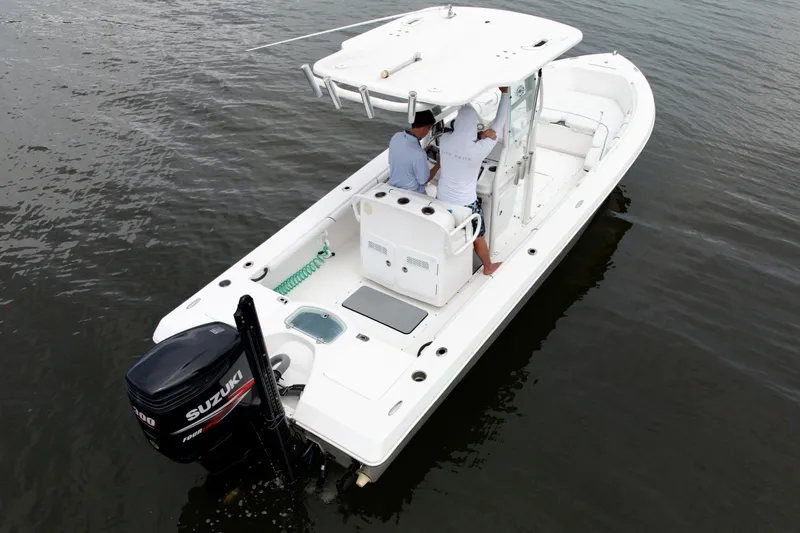 Slide: The Image of 2007 Everglades 243 Center Console boat on water, featuring Suzuki outboard motor. - 6