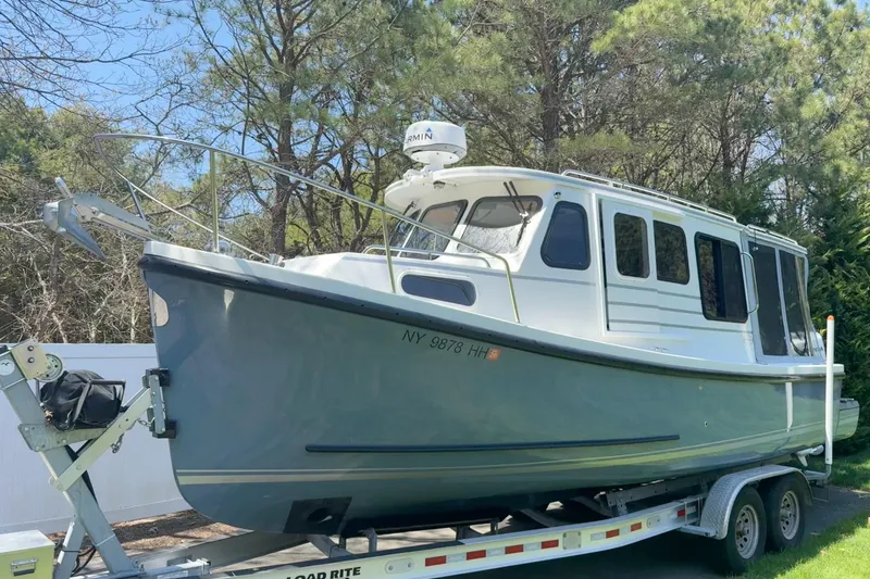 The Image of 2023 Rosborough 246 Halifax boat on trailer, surrounded by trees. - 1