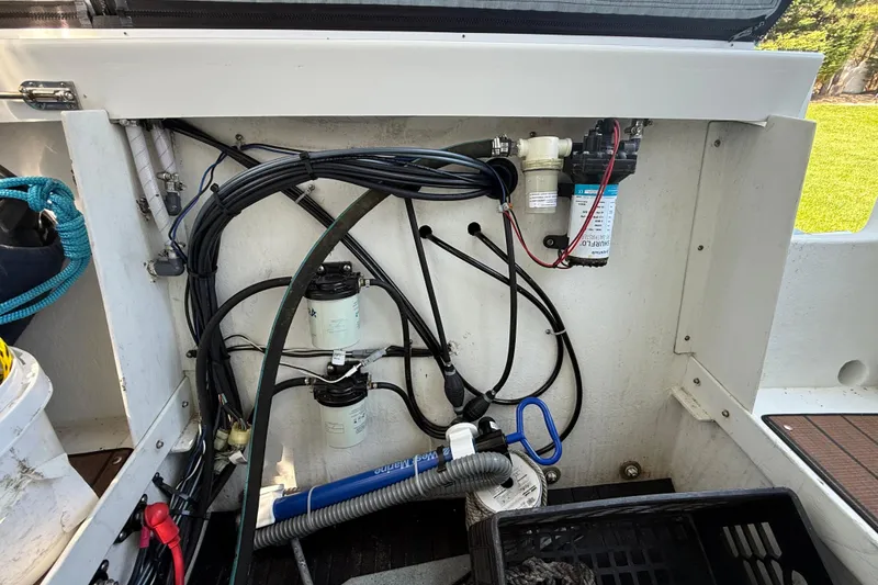 Slide: The Image of Interior view of 2023 Rosborough 246 Halifax boat showing wiring and filtration system. - 71