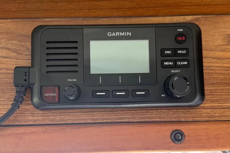 Slide: The Image of Garmin marine radio on 2023 Rosborough 246 Halifax boat dashboard. - 55