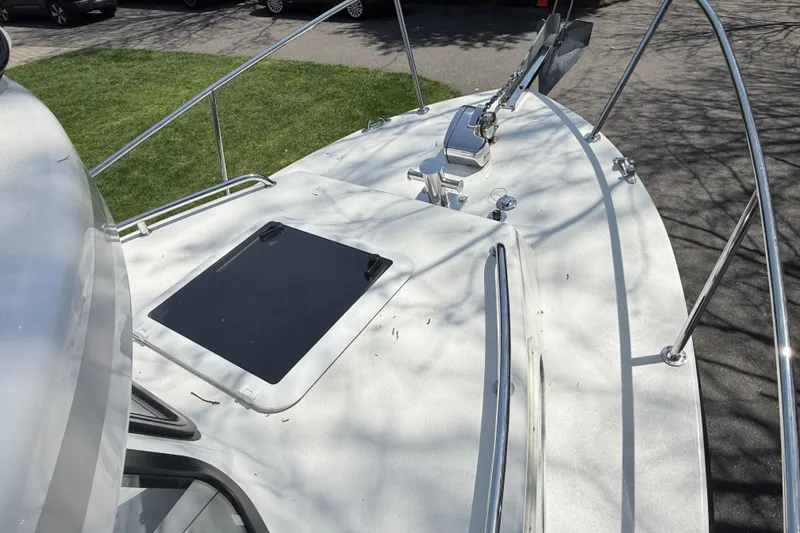 Slide: The Image of 2023 Rosborough 246 Halifax boat deck with hatch and anchor, parked on grass. - 41