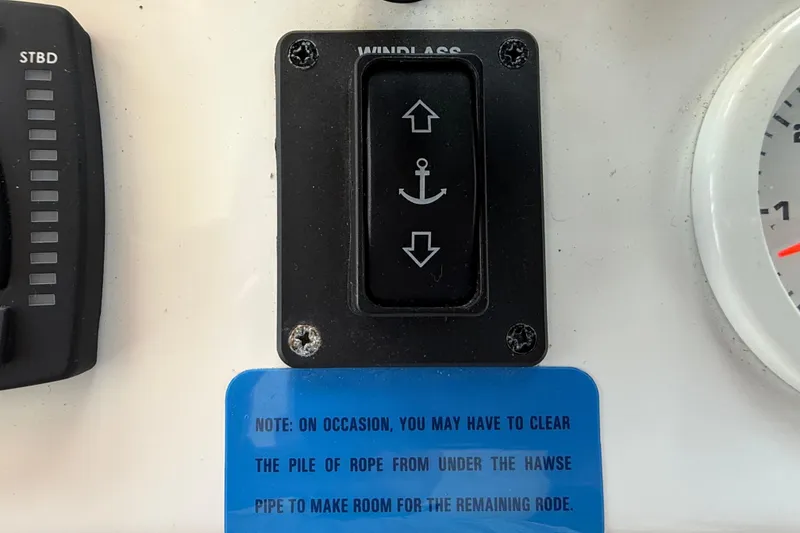 Slide: The Image of Control panel of 2023 Rosborough 246 Halifax boat with windlass switch and note. - 63