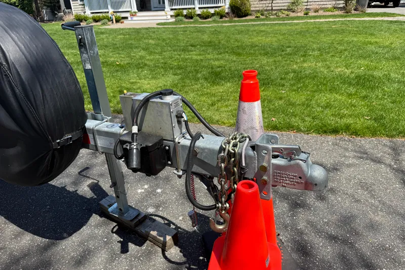 Slide: The Image of Trailer hitch of 2023 Rosborough 246 Halifax with safety chains and traffic cones. - 69