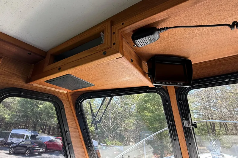 Slide: The Image of Interior view of 2023 Rosborough 246 Halifax boat with wood paneling and communication equipment. - 50