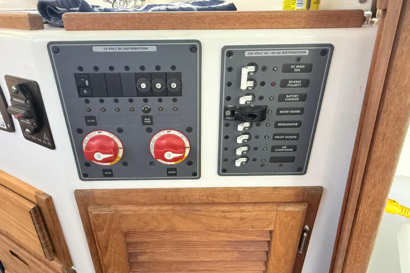 Slide: The Image of Electrical control panel on 2023 Rosborough 246 Halifax boat, featuring switches and circuit breakers. - 48