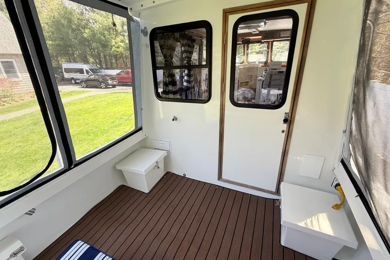 Slide: The Image of Interior of 2023 Rosborough 246 Halifax boat with wooden flooring and seating. - 37