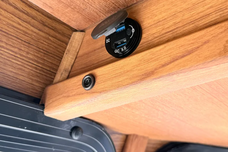 Slide: The Image of 2023 Rosborough 246 Halifax interior with USB charging port on wooden panel. - 57