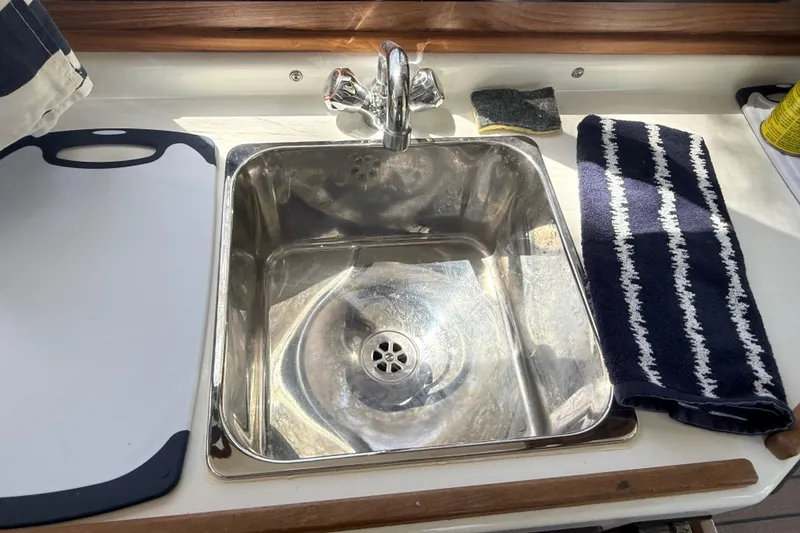 Slide: The Image of Stainless steel sink in 2023 Rosborough 246 Halifax boat kitchen area. - 14