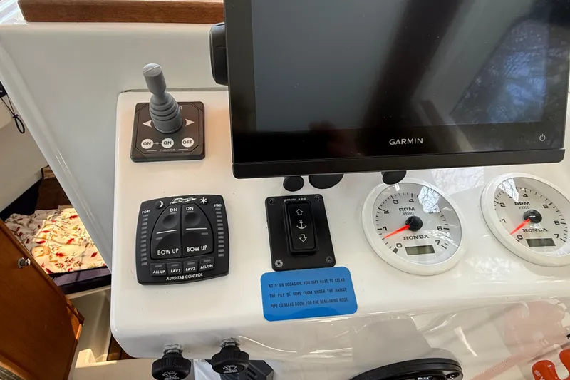 Slide: The Image of Control panel of 2023 Rosborough 246 Halifax boat with Garmin display and gauges. - 59