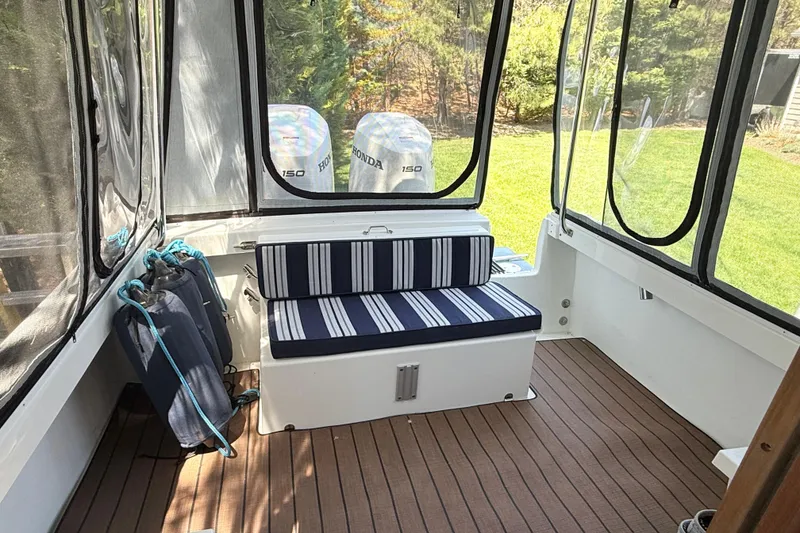 Slide: The Image of Interior of 2023 Rosborough 246 Halifax boat with striped seating and Honda engines. - 36