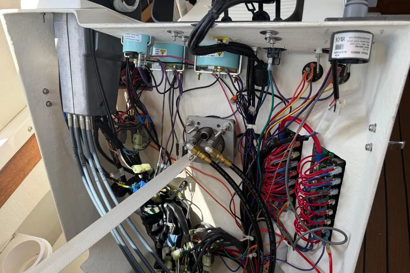 Slide: The Image of Electrical wiring inside a 2023 Rosborough 246 Halifax boat, showcasing complex connections and components. - 26