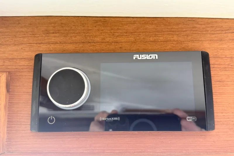 Slide: The Image of Fusion audio system on 2023 Rosborough 246 Halifax boat, featuring touchscreen and control knob. - 58